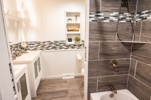 Combined shower/tub, hair dryer, towels, soap