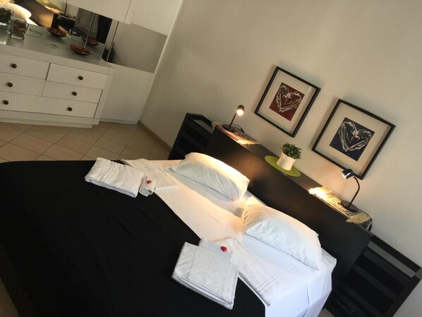 1 bedroom, desk, iron/ironing board, bed sheets