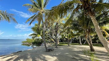 On the beach, sun-loungers, beach towels
