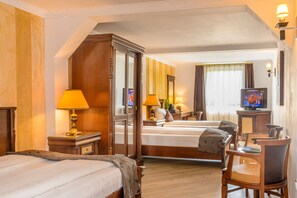 Luxe beddengoed, bedden met traagschuimmatrassen, een minibar