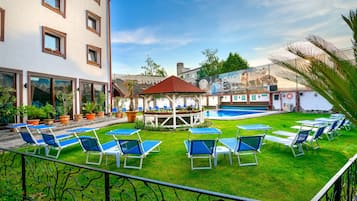 Seasonal outdoor pool, open 10:00 AM to 9:00 PM, sun loungers