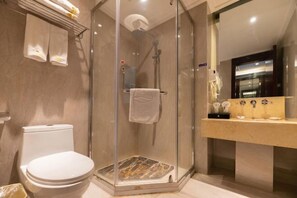 A bathroom with a glass-enclosed shower, a toilet, and a vanity with a mirror. - Baoqing Villa (Shaoyang)