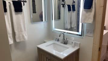 Shower, towels, soap, toilet paper