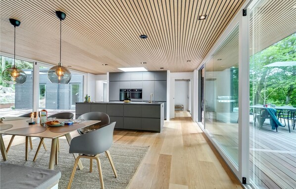 Enjoy cooking in this well-lit kitchen with a central island and ample counter space.