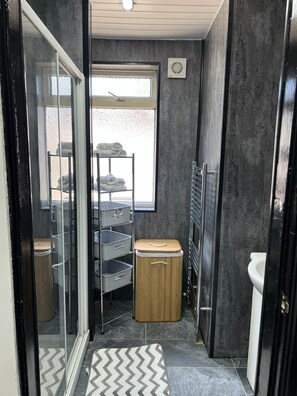 Shower, hair dryer, towels, soap