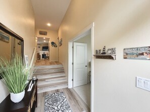 Enter a cozy space with a fireplace and TV, featuring a comfortable seating area and a warm welcome.