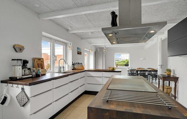 Fridge, stovetop, dishwasher, coffee/tea maker
