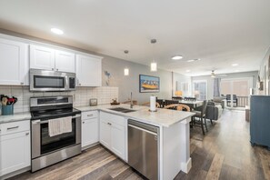 Fridge, microwave, oven, stovetop - Poolside Condo | Modern Charm, Heated Pool & Steps to Beach (Corpus Christi)