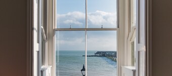 Light, bright, and colourful apartment opposite Deal pier
