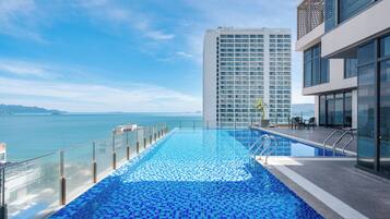 Outdoor pool, open 7:00 AM to 8:00 PM, pool umbrellas, pool loungers