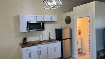 Fridge, microwave, coffee/tea maker, toaster