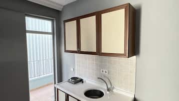 Fridge, cookware/dishes/utensils, cleaning supplies