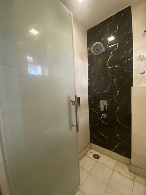 Shower, rainfall showerhead, designer toiletries, towels