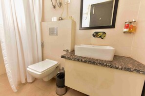 Classic Room | Bathroom | Shower, rainfall showerhead, towels - Hotel Orchid Saffron (New Delhi)