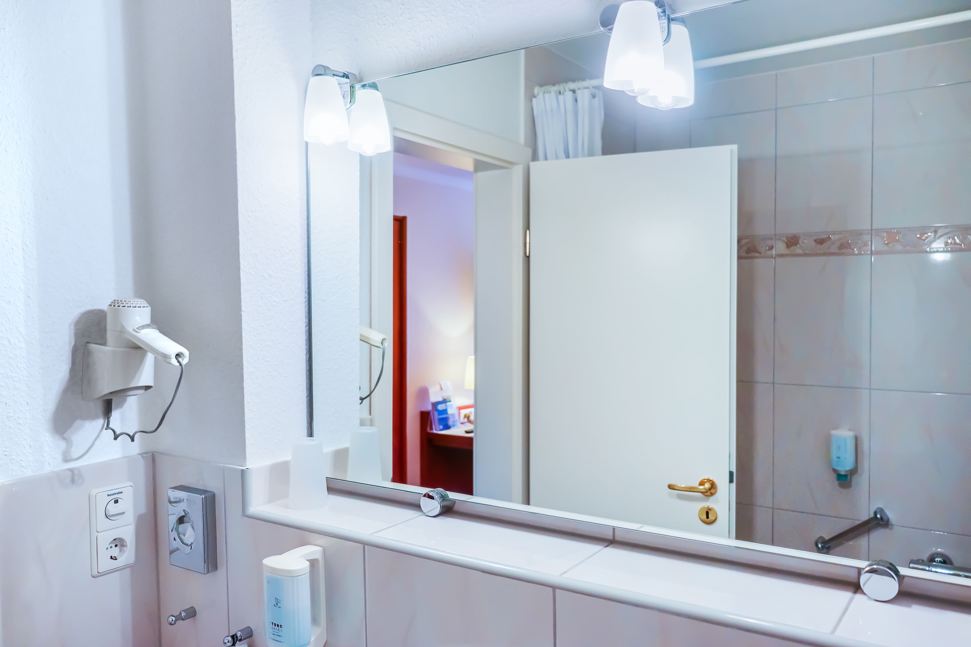 separate bathtub and shower, hair dryer, towels, soap