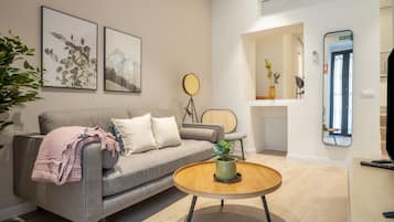 Two-Bedroom Apartment (Ground Floor) | Living area | 40-inch Smart TV with cable channels, TV