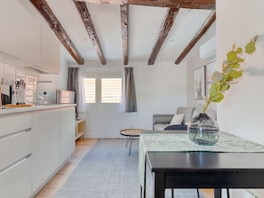 One-Bedroom Attic Apartment | Living area | 40-inch Smart TV with cable channels, TV - Limehome Madrid C. de Fomento (Madrid)
