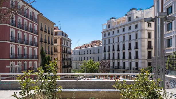 A multi-story building with balconies and a central courtyard. - Limehome Madrid C. de Fomento (Madrid)
