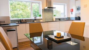 Exclusive Townhome | Private kitchen | Full-size fridge, microwave, oven, dishwasher