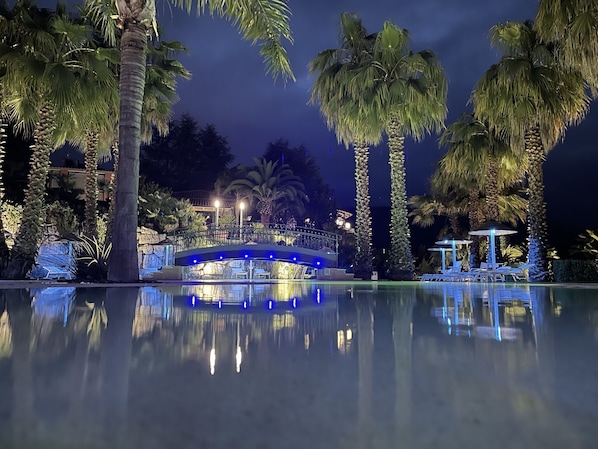 2 outdoor pools, open 10:00 AM to 6:30 PM, pool umbrellas, pool loungers