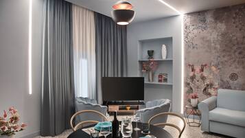 Apartamento luxo | Área de estar | TV de tela plana