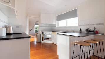 Fridge, coffee/tea maker, highchair, dining tables