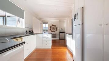 Fridge, coffee/tea maker, high chair, dining tables