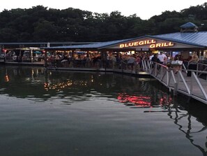 A waterfront restaurant named Bluegill Grill with outdoor seating and a dock. - Bueller's Barrel House - Your Exquisite Getaway (Golf Cart Included) (Tullahoma)