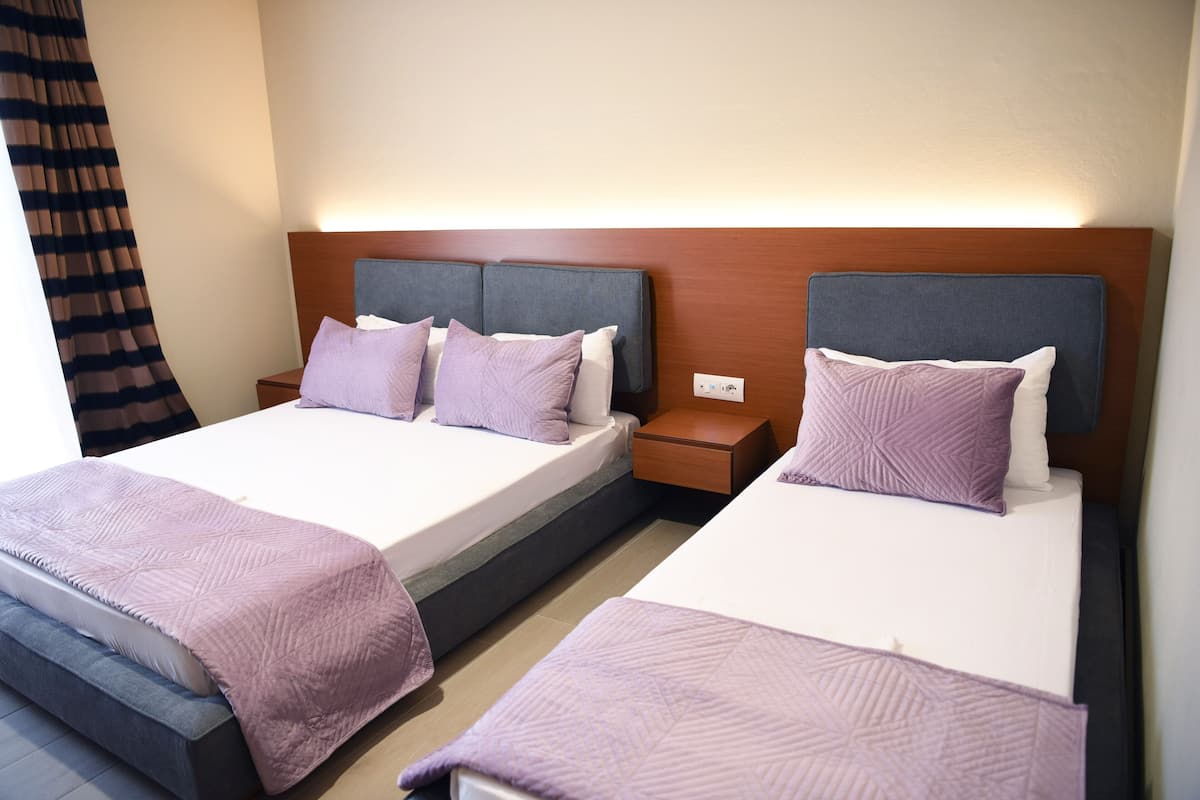 Triple Room, City View | In-room safe, desk, laptop workspace, soundproofing