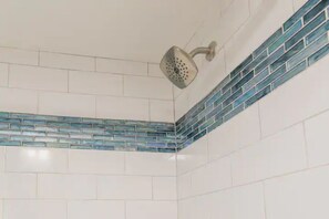 Shower, towels, soap, toilet paper
