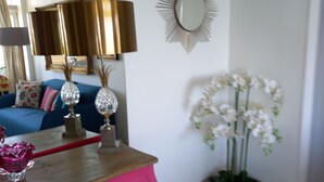 A pink dresser with drawers, a mirror, and decorative items. - La Goelette 4 (Toulon)