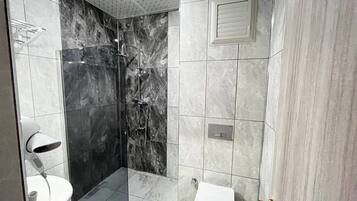 Shower, rainfall showerhead, hair dryer, towels