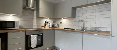 Luxury Apartment | Private kitchen | Fridge, microwave, oven, stovetop
