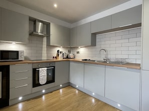 Luxury Apartment | Private kitchen | Fridge, microwave, oven, stovetop