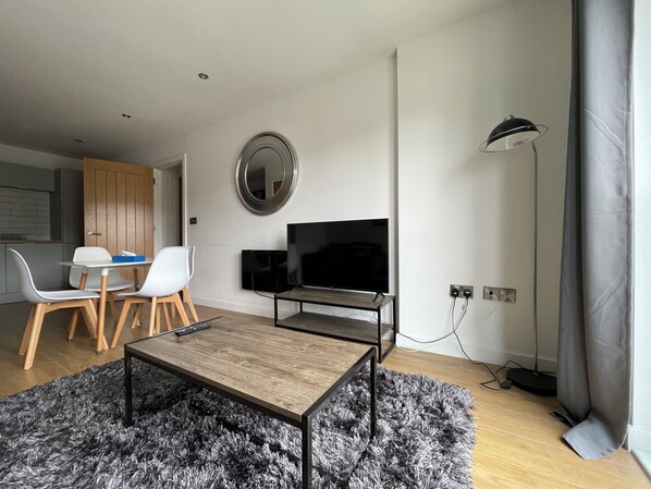 Luxury Apartment | Living area | 40-inch LCD TV with cable channels