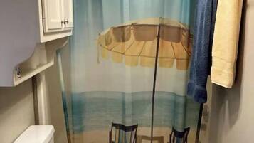 Combined shower/bathtub, hair dryer, towels, soap
