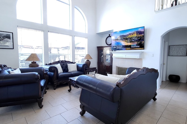 Main Living room, High ceiling Chandelier, Leather furniture, 75" Hdtv, Wifi