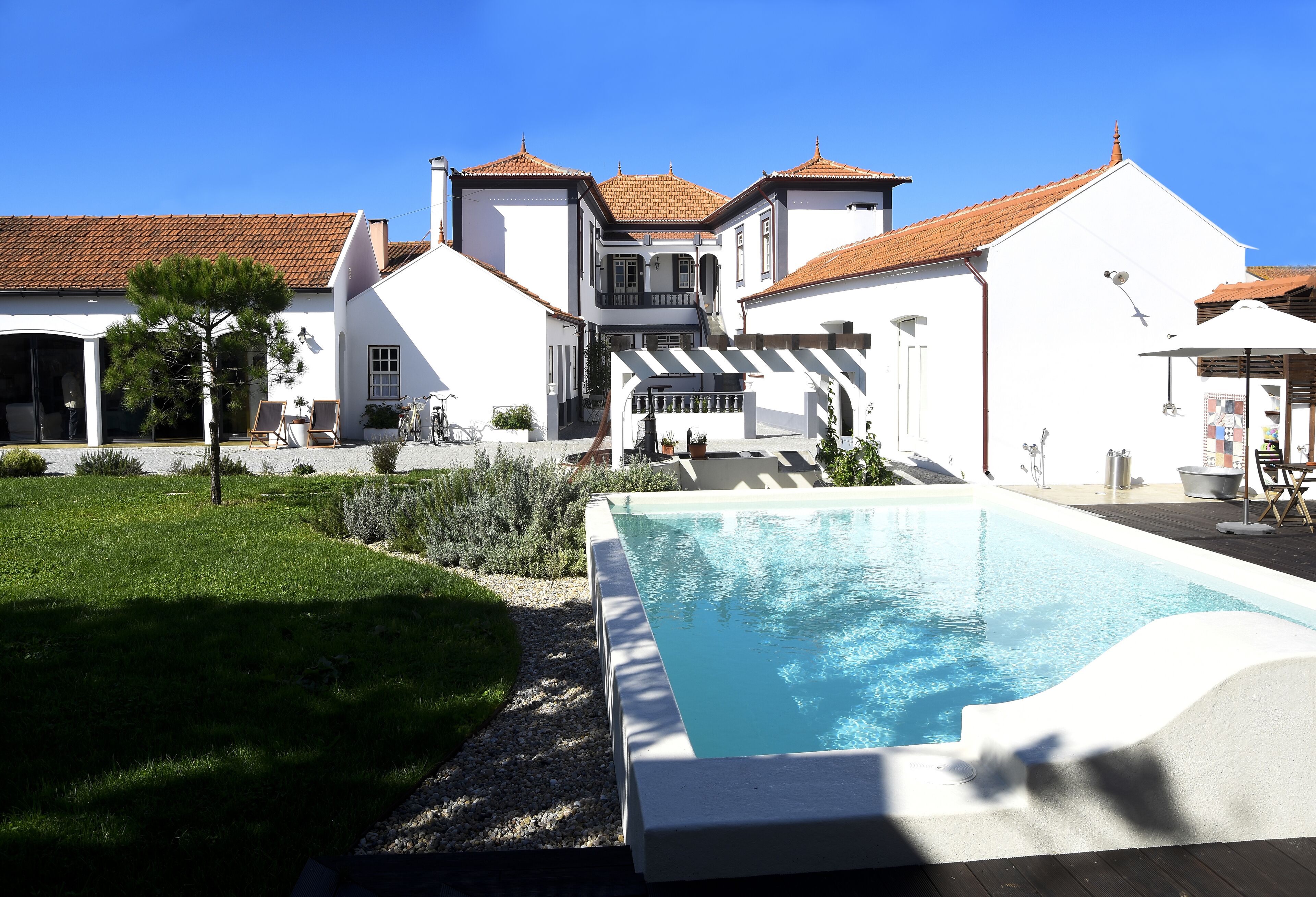 Seasonal outdoor pool, pool umbrellas, pool loungers