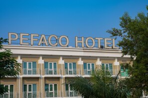 A hotel with a prominent sign reading "PEFACCO HOTEL" above the entrance. - Pefaco Hotel Maya Maya (Brazzaville)