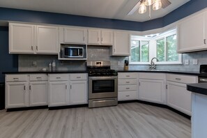 Fridge, microwave, oven, stovetop - Lake Michigan Retreat โ Cozy Remodeled 3BR Getaway Near Scenic Beaches! (Muskegon)