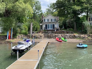 Enjoy serene lakeside views from the deck, where a kayak awaits for a leisurely paddle.