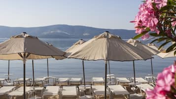 On the beach, free beach cabanas, sun-loungers, beach umbrellas