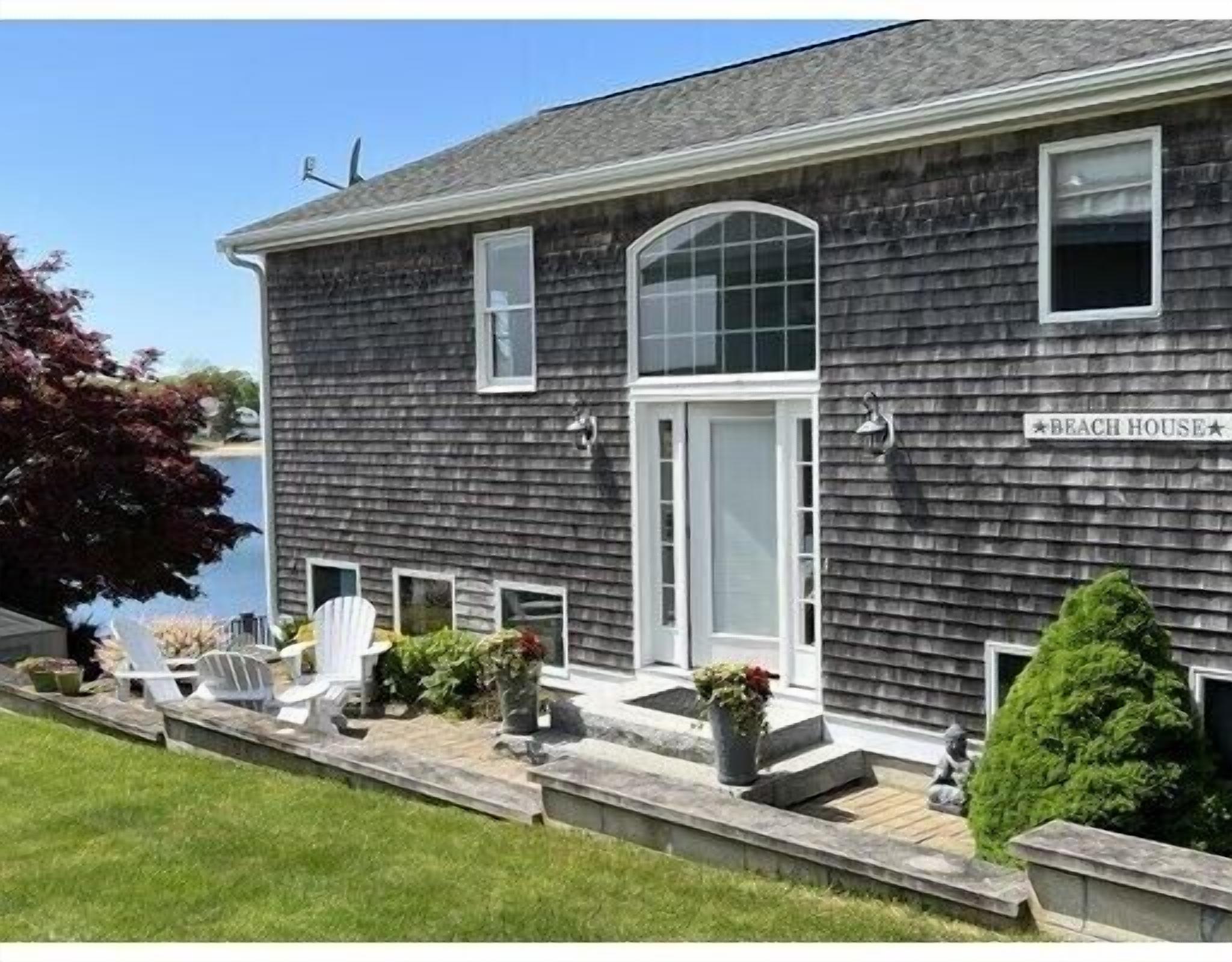 Peaceful waterfront home with a spacious deck and four bedrooms.