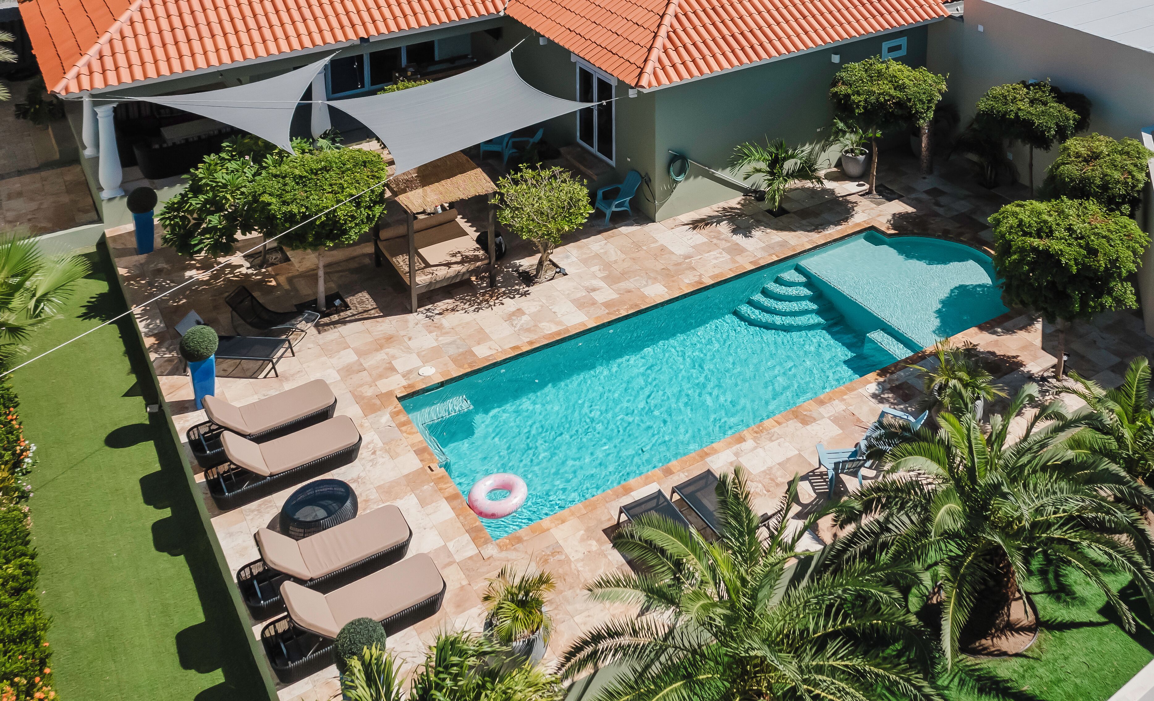 Enjoy the extra-large pool in the private tropical garden