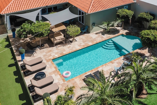 Enjoy the extra-large pool in the private tropical garden