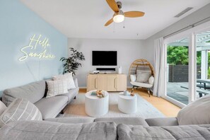 Smart TV, fireplace, books, printers