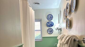 Combined shower/tub, hair dryer, towels, soap