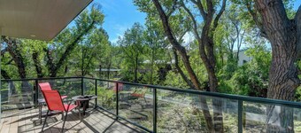 Modern cabin hidden among the trees-- Unwind and relax on the porch creek-side. 