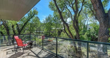 Modern cabin hidden among the trees-- Unwind and relax on the porch creek-side.