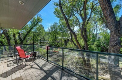 Modern cabin hidden among the trees-- Unwind and relax on the porch creek-side. 